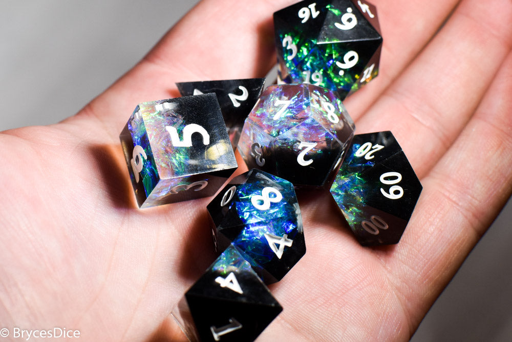 Deep Nether Sharp Edge Resin 7-Dice Dice (Blue-Green and Black w/ White Numbers)